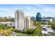 Panoramic exterior shot of luxury high-rise apartments surrounded by lush greenery and neighborhood streets at 795 Hammond Dr # 801, Atlanta, GA 30328