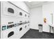 Community laundry room featuring multiple rows of washing machines at 795 Hammond Dr # 801, Atlanta, GA 30328