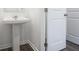 Elegant pedestal sink in a well-lit bathroom with neutral decor and modern fixtures at 203 Groveton Ct, Euharlee, GA 30145