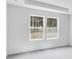 Bright and airy bedroom with two windows offering natural light and a serene view at 203 Groveton Ct, Euharlee, GA 30145