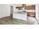 Beautiful kitchen with stainless steel appliances, granite countertops and a large island at 203 Groveton Ct, Euharlee, GA 30145