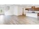 Open-concept living area with kitchen island and stainless steel appliances at 203 Groveton Ct, Euharlee, GA 30145