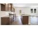 Well-equipped kitchen with stainless steel appliances, granite countertops, and ample cabinet space at 203 Groveton Ct, Euharlee, GA 30145