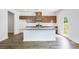 Kitchen features a large island with granite countertops and stainless steel appliances at 203 Groveton Ct, Euharlee, GA 30145