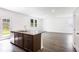 A spacious kitchen featuring a central island with a sink and ample countertop space for food preparation at 203 Groveton Ct, Euharlee, GA 30145