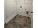 Laundry room with tile floors, storage shelf and washer dryer hookups at 203 Groveton Ct, Euharlee, GA 30145