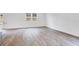 Spacious and inviting living room featuring hardwood floors and ample natural light at 203 Groveton Ct, Euharlee, GA 30145