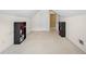 Attic bonus room with carpet, a window, and built in bookshelves at 3402 Blaisdell Rd, Buford, GA 30519