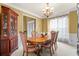 Traditional dining room with elegant furniture, and natural light at 3402 Blaisdell Rd, Buford, GA 30519