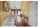 Bright entryway featuring hardwood floors, stairs, and artwork at 3402 Blaisdell Rd, Buford, GA 30519