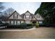 Charming two-story home with a well-manicured lawn and mature landscaping at 3402 Blaisdell Rd, Buford, GA 30519