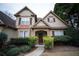 Inviting home exterior featuring manicured bushes and a walkway leading to the front door at 3402 Blaisdell Rd, Buford, GA 30519