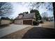 Side view of home with an attached garage and long driveway at 3402 Blaisdell Rd, Buford, GA 30519
