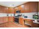 Updated kitchen featuring stainless steel appliances, modern cabinetry, tile backsplash and hardwood floors at 3402 Blaisdell Rd, Buford, GA 30519