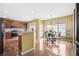 Spacious kitchen with wood floors, stainless appliances, and eat-in dining area at 3402 Blaisdell Rd, Buford, GA 30519