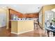 Inviting kitchen with wood cabinets, stainless steel appliances, and a breakfast bar at 3402 Blaisdell Rd, Buford, GA 30519