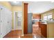 View of kitchen with stainless appliances and hardwood floors, connecting to laundry room at 3402 Blaisdell Rd, Buford, GA 30519