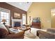 Comfortable living room with a fireplace, neutral tones, and ample seating at 3402 Blaisdell Rd, Buford, GA 30519