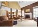 Spacious living room with a fireplace, high ceilings, and an open floor plan at 3402 Blaisdell Rd, Buford, GA 30519