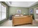 Inviting main bedroom features tray ceiling, carpeted floors, and neutral wall color at 3402 Blaisdell Rd, Buford, GA 30519