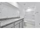 Bathroom with granite vanity top and a shower and tub combo at 362 Rock View Ln, Covington, GA 30016