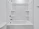 This bathroom features a bathtub and shower with a white surround at 362 Rock View Ln, Covington, GA 30016