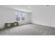 Spacious carpeted bedroom with natural light, featuring stone countertop with sink cutouts at 362 Rock View Ln, Covington, GA 30016