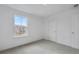 Bright carpeted bedroom with a window view of neighborhood, next to closet at 362 Rock View Ln, Covington, GA 30016