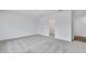 This bedroom features plush carpet, neutral walls, and a spacious walk-in closet at 362 Rock View Ln, Covington, GA 30016