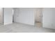 Spacious bedroom with plush carpeting, two closets, and a view into an ensuite bathroom with a closed door at 362 Rock View Ln, Covington, GA 30016