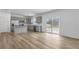 Bright open-concept kitchen with stainless steel appliances and access to a large sliding glass door at 362 Rock View Ln, Covington, GA 30016