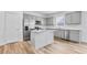 Modern kitchen with stainless steel appliances, gray cabinetry, and an island with a granite countertop at 362 Rock View Ln, Covington, GA 30016