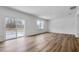 Bright open-concept living area features durable flooring, a sliding glass door and a large window at 362 Rock View Ln, Covington, GA 30016