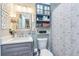 Cozy bathroom features a sink with modern fixtures, storage cabinet, and patterned shower curtain at 387 Pine Trail, Canton, GA 30115