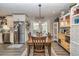 Dining area with stainless appliances and a charming chandelier at 387 Pine Trail, Canton, GA 30115