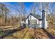 Side view of a well-maintained single-story home with wood accents at 387 Pine Trail, Canton, GA 30115