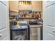 Functional laundry room with modern washer and dryer set, ample storage and shelving for laundry supplies at 387 Pine Trail, Canton, GA 30115