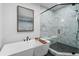 Modern bathroom with a freestanding tub, marble shower, and black hexagon tile flooring at 315 Chiswick Cir # 38, Alpharetta, GA 30009
