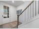 Bright foyer features natural light and wooden stairs at 315 Chiswick Cir # 38, Alpharetta, GA 30009