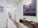 Bright hallway with hardwood floors, stylish console table, and elegant artwork creating a welcoming entrance at 315 Chiswick Cir # 38, Alpharetta, GA 30009