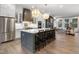 Spacious kitchen with large center island, barstool seating, and stainless steel appliances at 315 Chiswick Cir # 38, Alpharetta, GA 30009