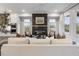 Modern living room with a striking fireplace, recessed lighting, and an open concept design for seamless living at 315 Chiswick Cir # 38, Alpharetta, GA 30009