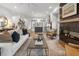 Open living space with hardwood floors, fireplace, and view into the kitchen at 315 Chiswick Cir # 38, Alpharetta, GA 30009