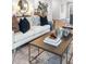 Comfortable living room featuring a white sofa, decorative pillows, and stylish coffee table at 315 Chiswick Cir # 38, Alpharetta, GA 30009