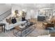 Spacious living room with a view to the kitchen featuring an open layout and hardwood flooring at 315 Chiswick Cir # 38, Alpharetta, GA 30009