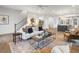 Bright open living room with modern decor, fireplace, and an open view of the kitchen at 315 Chiswick Cir # 38, Alpharetta, GA 30009