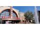 Exterior view of a Regal Cinema with box office, trees, fountain, and people enjoying the area at 315 Chiswick Cir # 38, Alpharetta, GA 30009