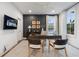 A home office features a ceiling fan and large windows, offering ample natural light at 315 Chiswick Cir # 38, Alpharetta, GA 30009