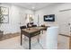 Bright office space with a sleek desk, modern decor, and a wall-mounted TV for a stylish workspace at 315 Chiswick Cir # 38, Alpharetta, GA 30009