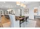 Open floor plan combining the kitchen, dining, and living areas with hardwood floors and stylish decor at 315 Chiswick Cir # 38, Alpharetta, GA 30009